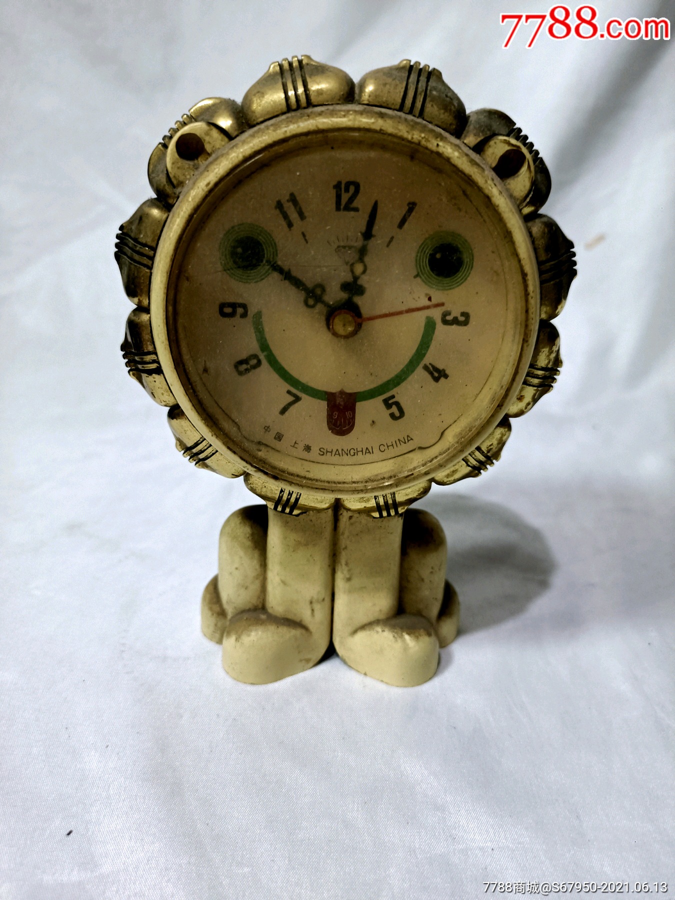 狮子闹钟,走时,响铃弦上不紧了.