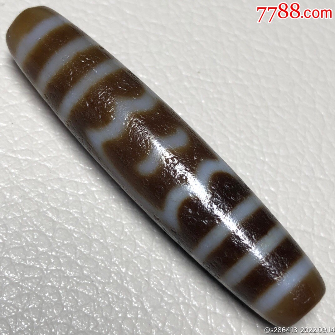 藏区回流老料高油包浆【大鹏鸟天珠】尺寸:56*12毫米重量14.