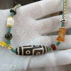 藏区回流老料龙鳞凤血【虎牙天珠】尺寸：57*12毫米重量14.4克__【7788